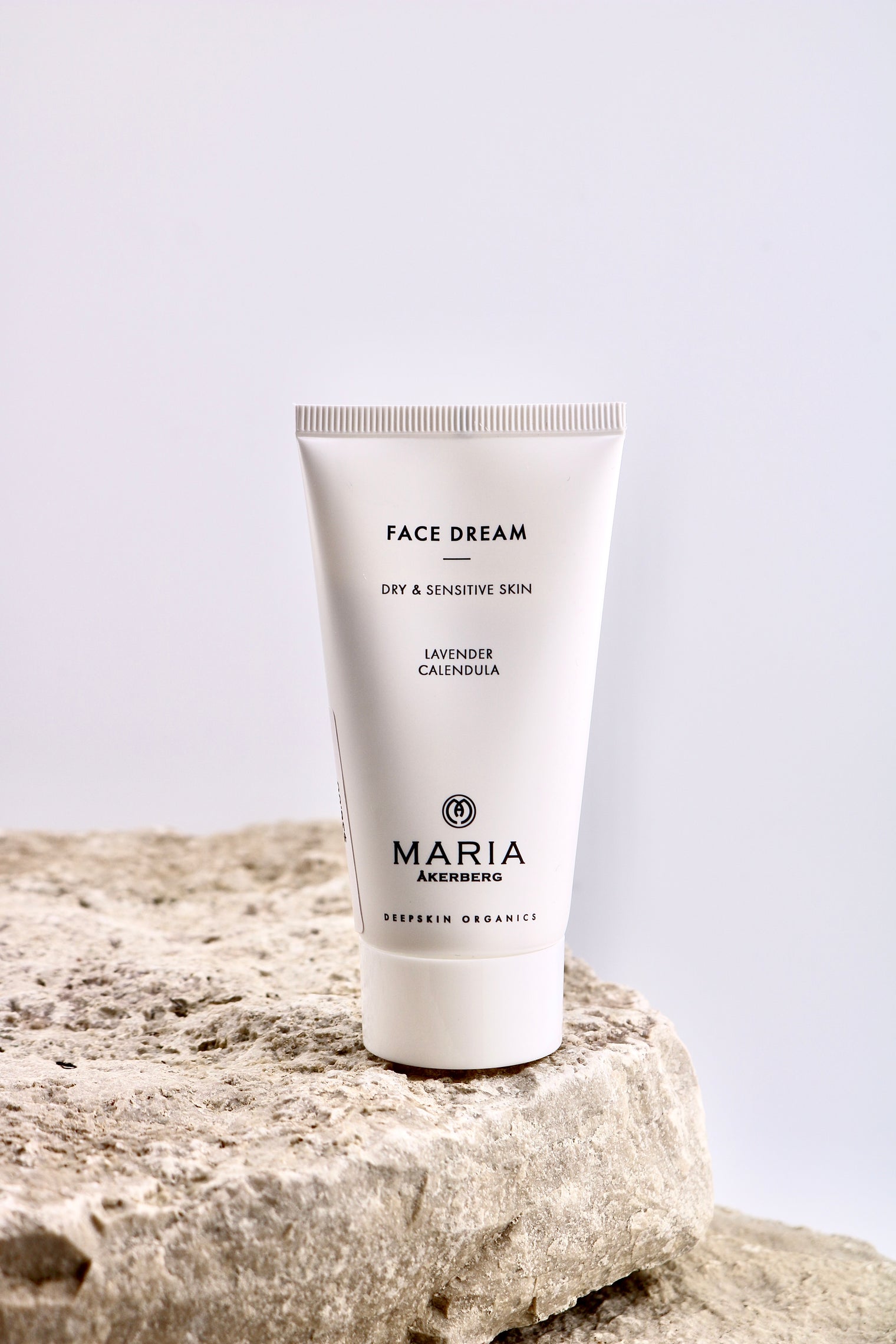 Tube of 'Face Dream' cream by Maria Åkerberg on a stone surface with a light background