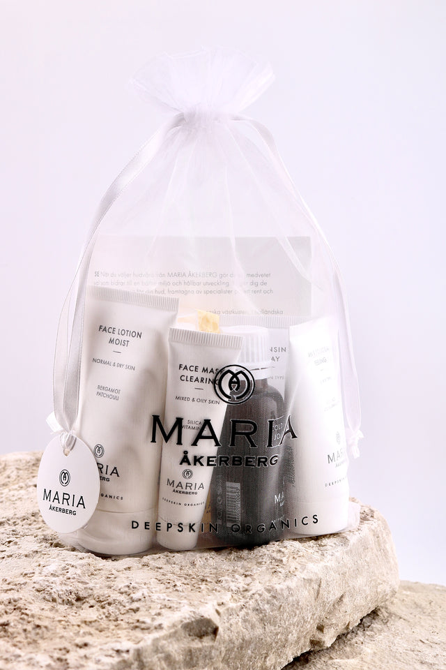 Set of skincare products from Maria Åkerberg on a textured surface with a white background