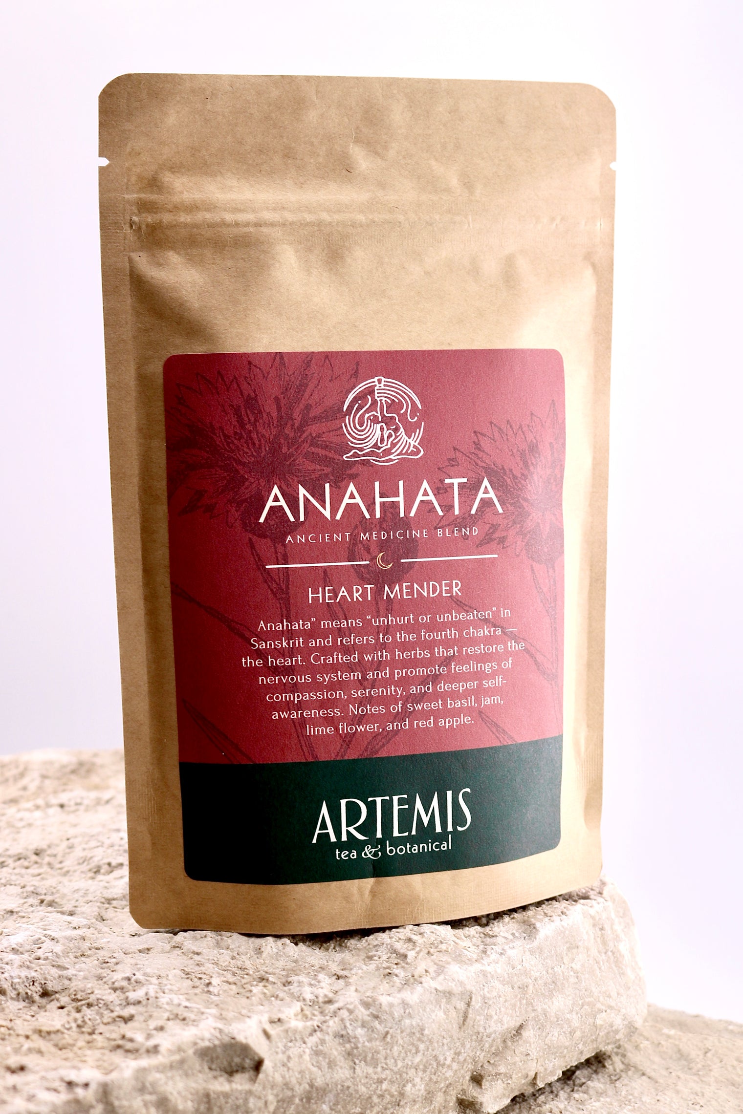 Tea package labeled 'Anahata' on a textured surface with a light background