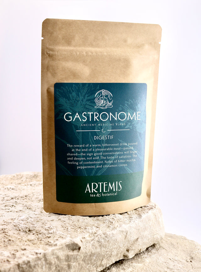 Gastronomè tea package with Artemis branding on a stone surface
