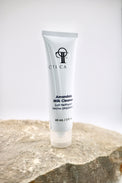 Tube of Circadia Amandola Milk Cleanser 2 ounces on a stone surface with a white background