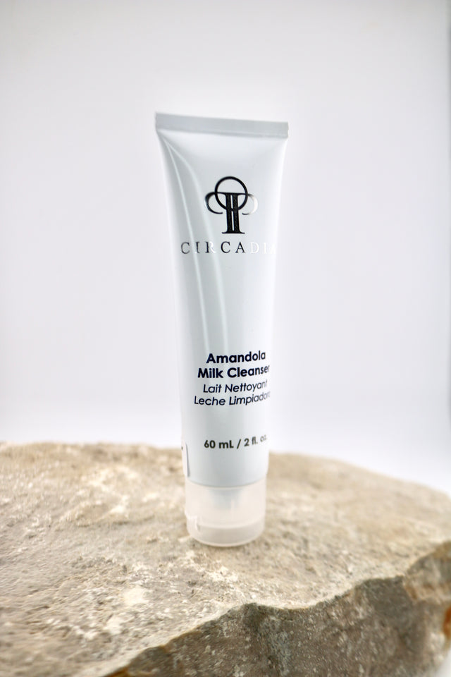 Tube of Circadia Amandola Milk Cleanser 2 ounces on a stone surface with a white background