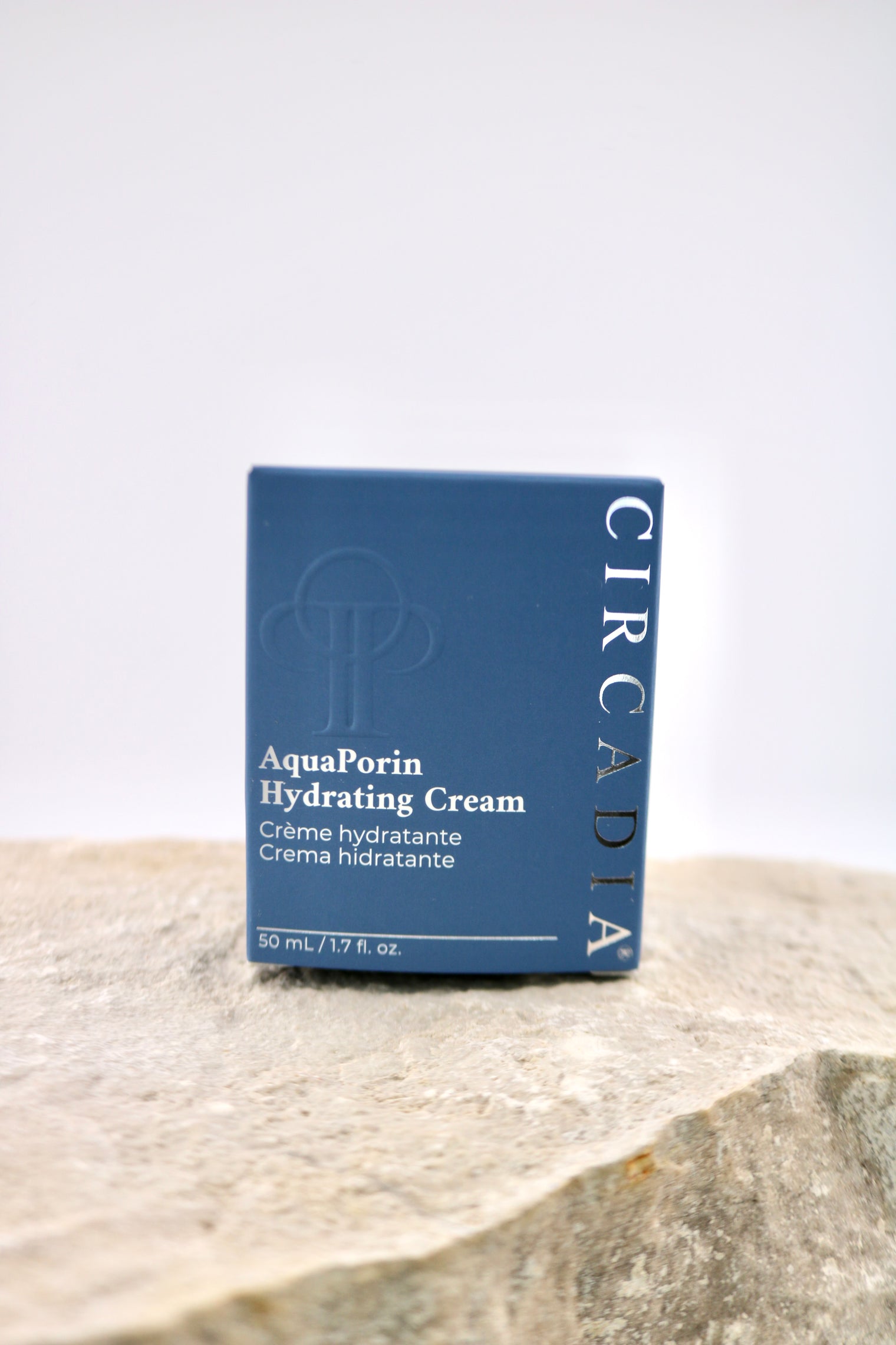 Circadia AquaPorin Hydrating Cream packaging on a stone surface with a light gray background