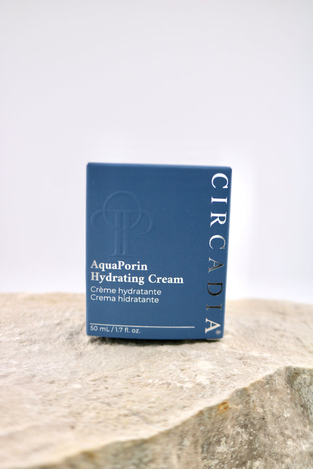 Circadia AquaPorin Hydrating Cream packaging on a stone surface with a light gray background