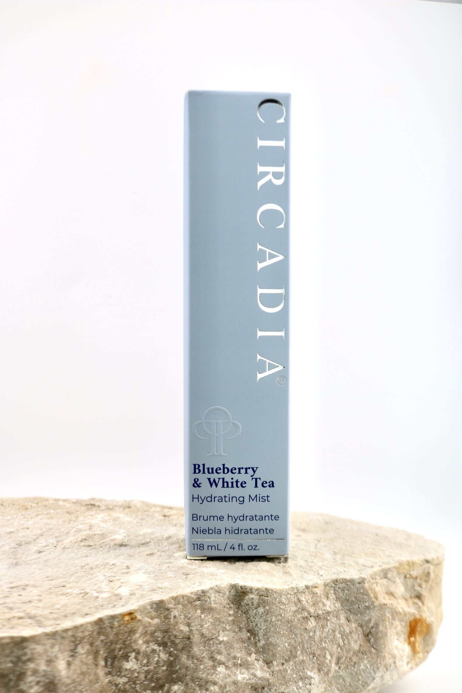 A tall rectangular box of Circadia Blueberry & White Tea Hydrating Mist stands upright on a rough stone slab against a clean white background.
