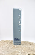 Circadia licorice and bearberry brightening mist packaging on a textured surface with a white background