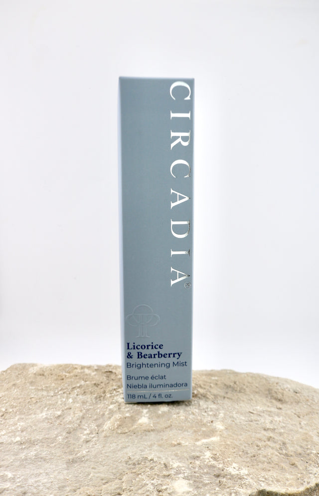 Circadia licorice and bearberry brightening mist packaging on a textured surface with a white background
