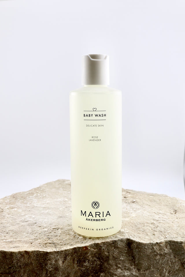 Bottle of Maria Åkerberg baby wash on a stone surface with a light background