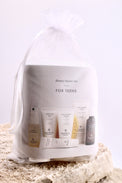 Beauty starter set for teens in a clear bag on a textured surface with a light background